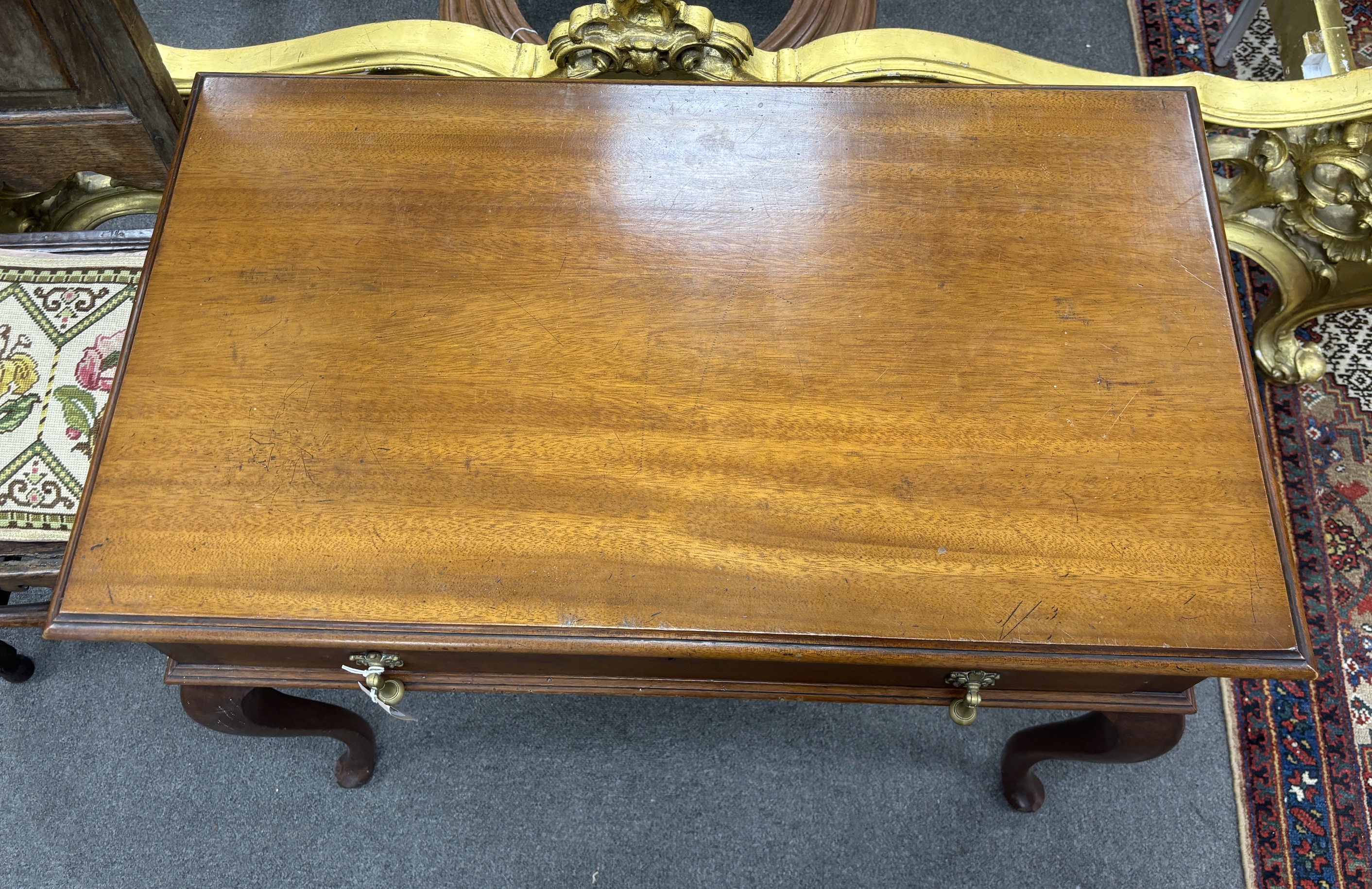 A 1920's mahogany cutlery table, width 85cm, depth 50cm, height 73cm